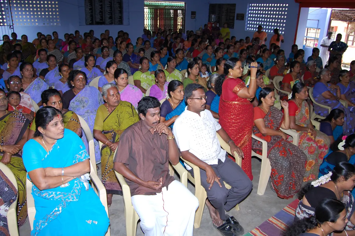 Community hall filled with women members for the 2014 SHG bank loan repayment recognition meeting
