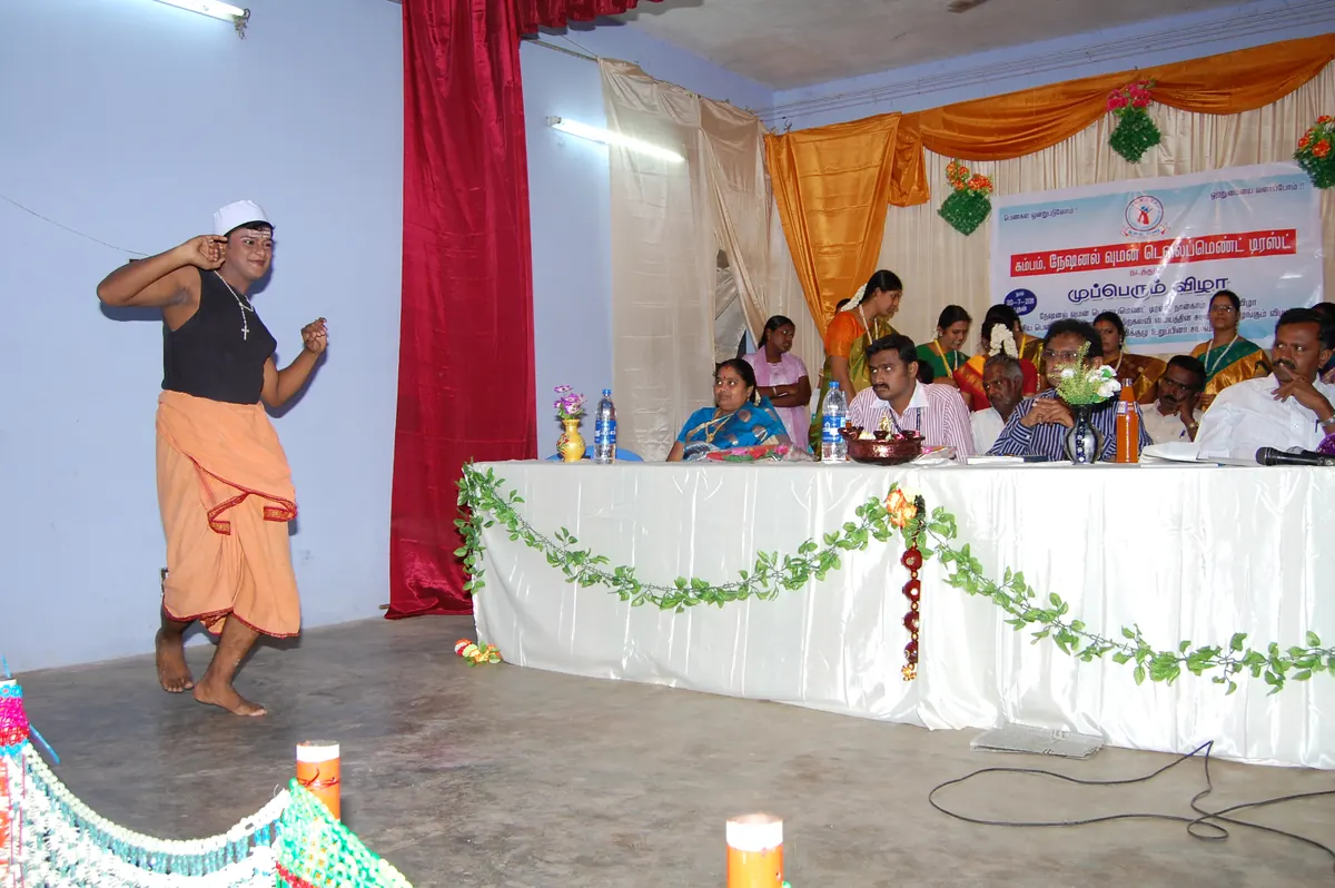 Youth artist in traditional costume performing dance on stage at NWDT annual festival