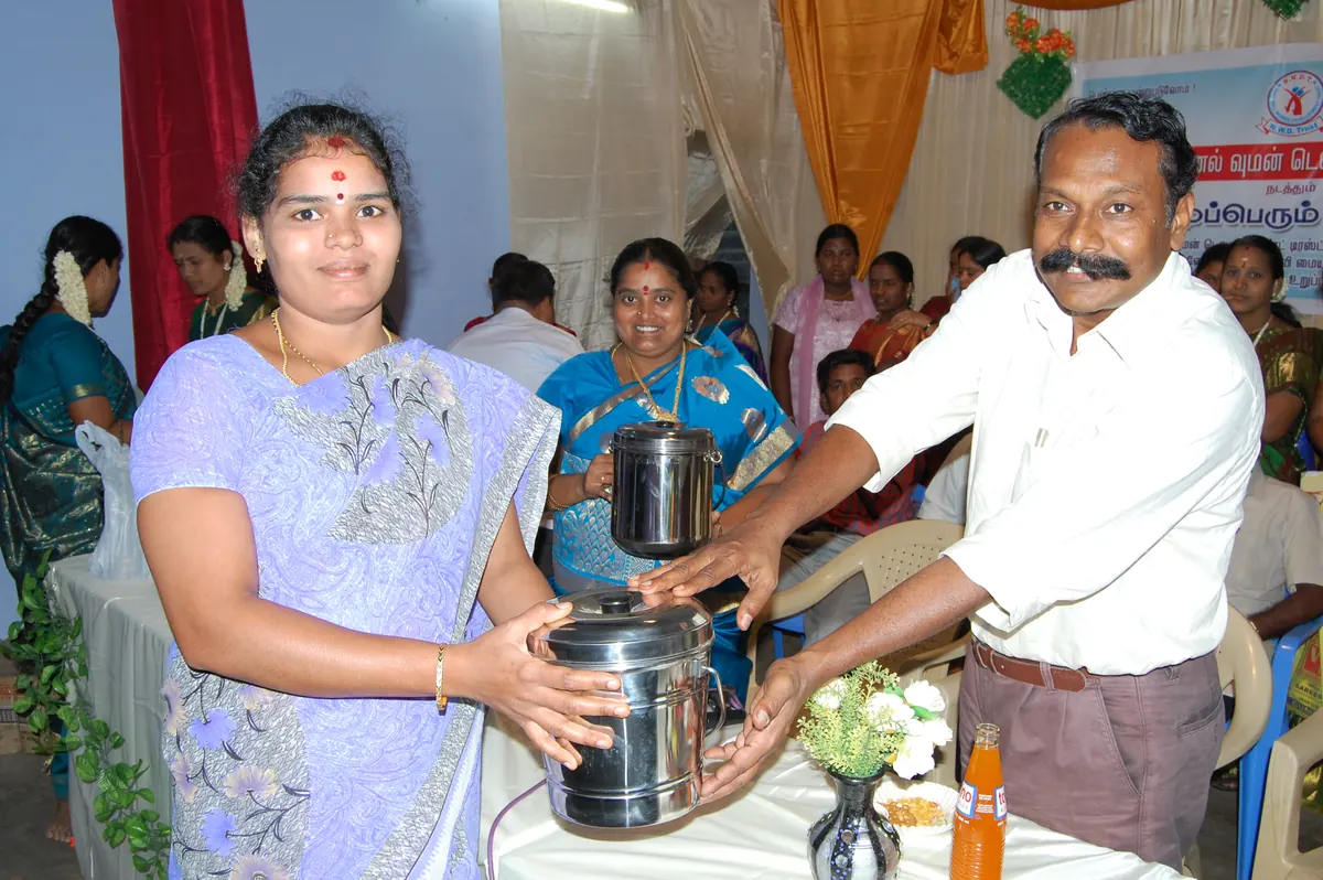 Prize presentation to active women SHG leader recognizing outstanding group participation