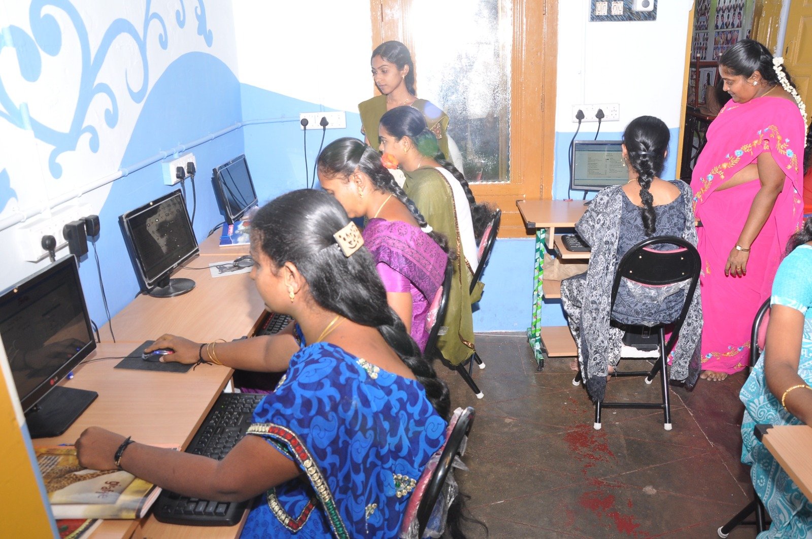 Young women learners practicing software applications in NWDT computer education centre