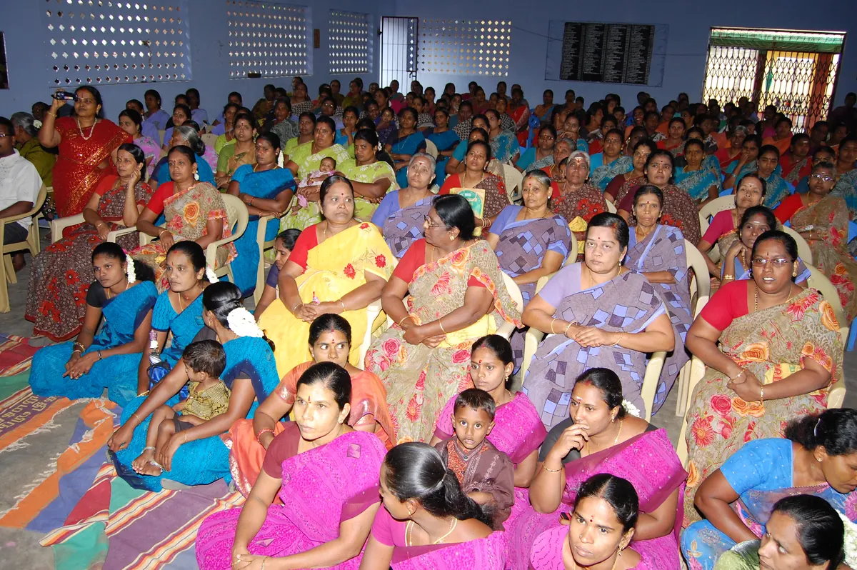 Women receiving recognition at an NWDT programme event